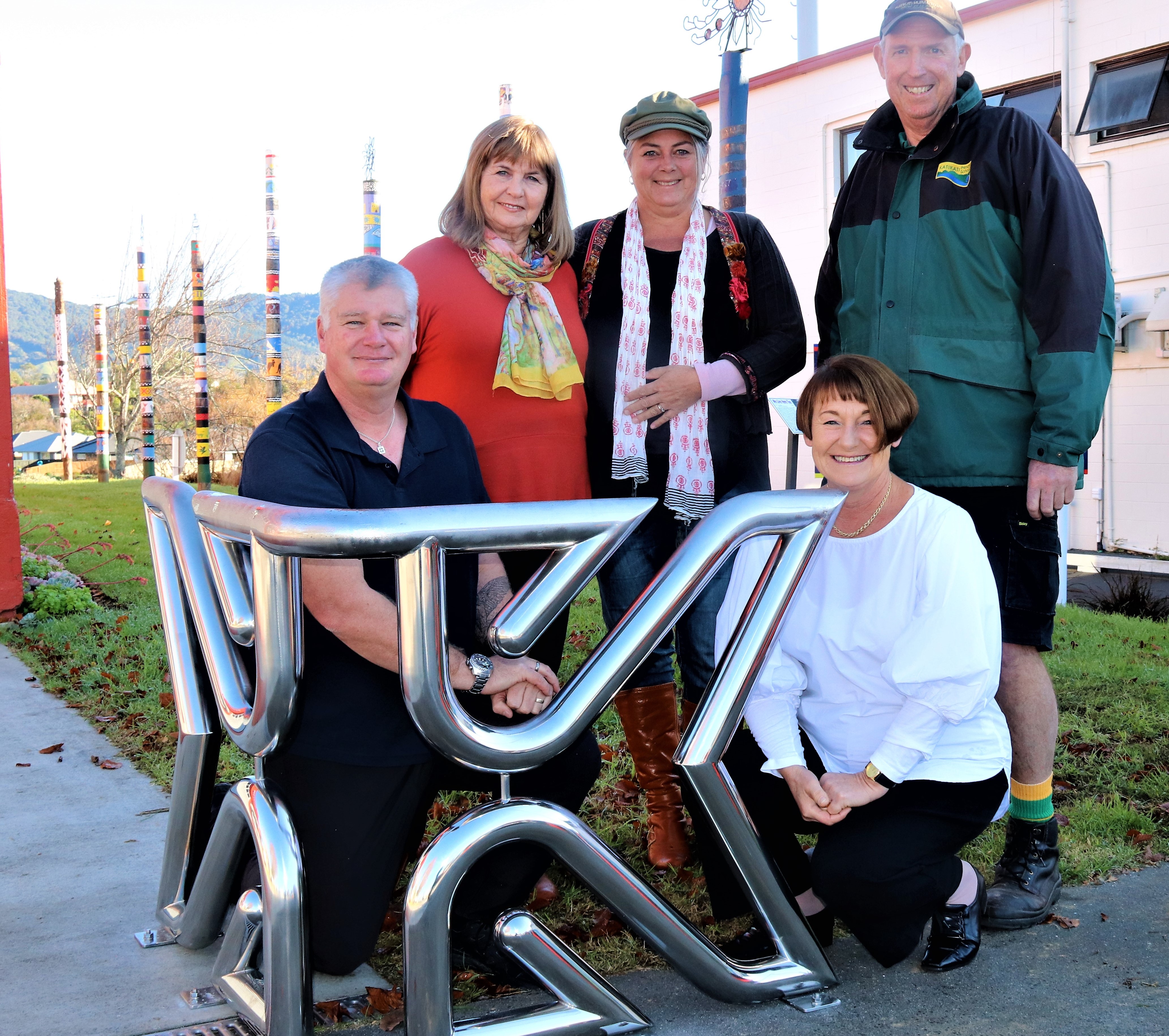 Bike rack artist Keith Lewis, Western Bay Councillor and Open-Air Arts Committee member Anne Henry, Katch Katikati Coordinator Jacqui Knight, Open-Air Art Chair Steve Graveson and Western Bay Museum Manager Paula Gaelic with the newly installed bike rack.​