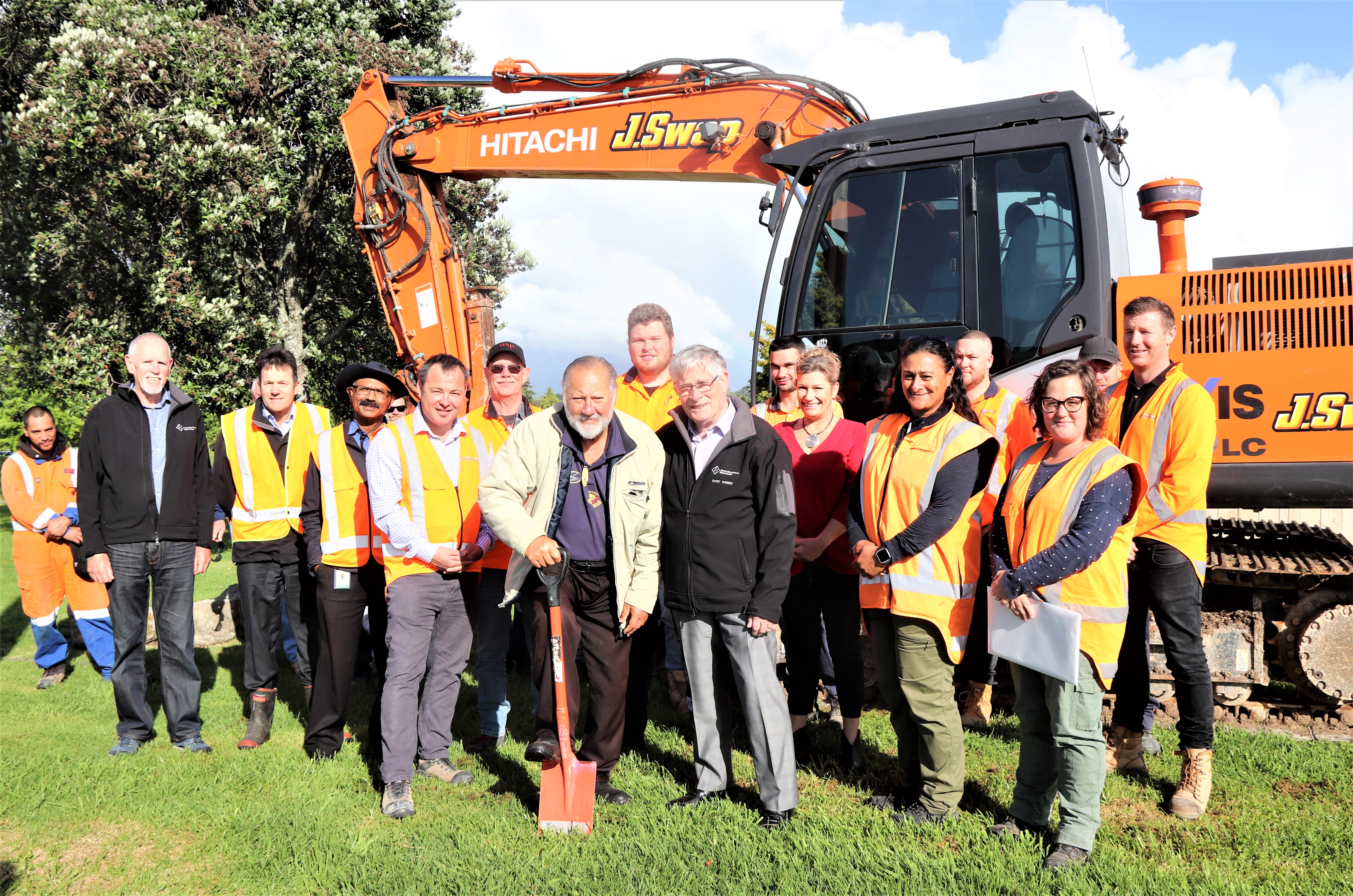 Omokoroa Road urbanisation project started today with a site blessing by Pirirakau hapū kaumatua Tame Kuku centre left and Mayor Garry Webber turning the first sod, along with J Swap Contract Manager Shanan Mowatt (left by Tame Kuka) and the Swap construction crew, Western Bay councillors and staff and project consultants.