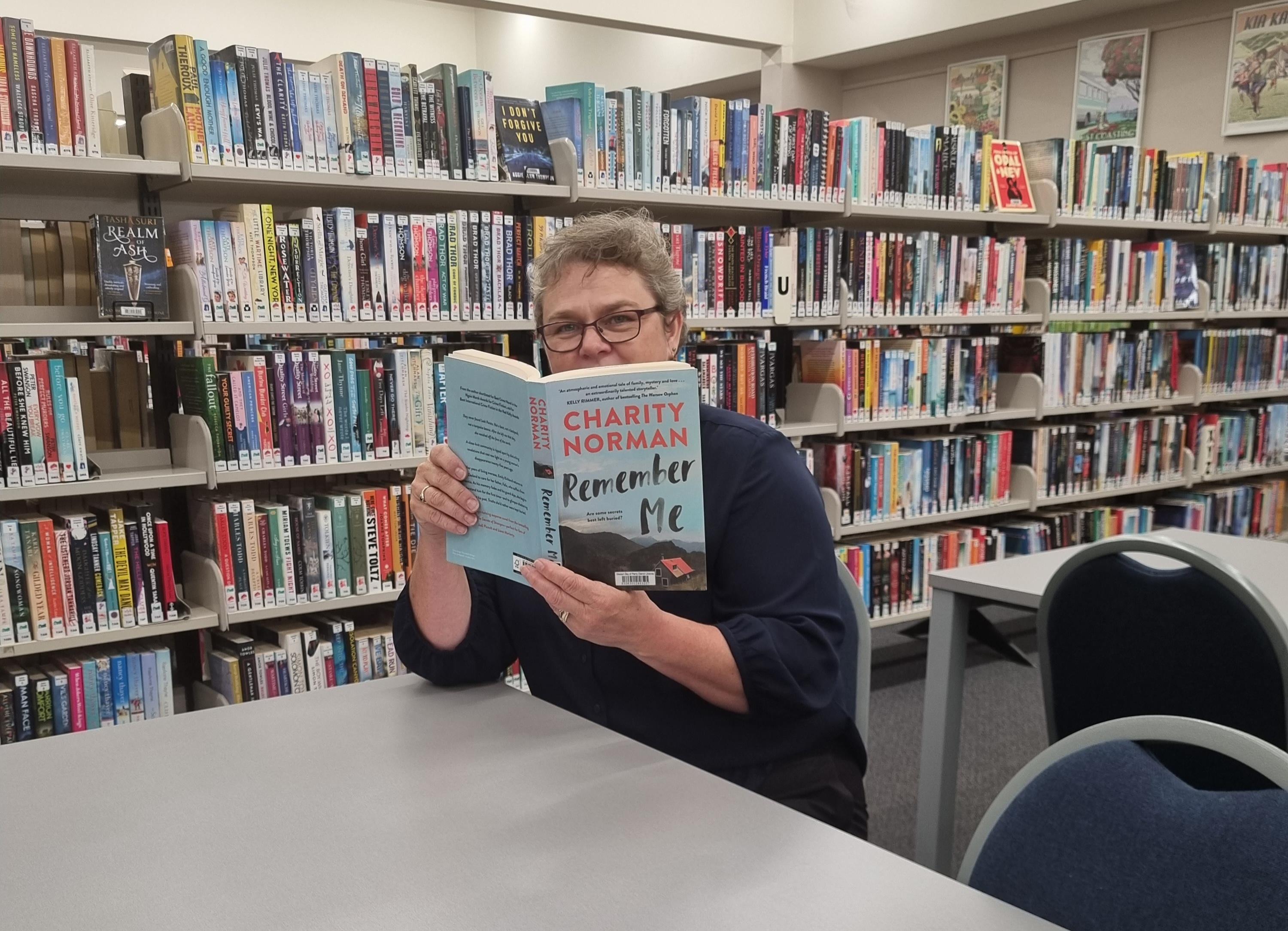  Linda from Te Puke Library and Service Centre with her reviewed book, Remember Me by Charity Norman.
