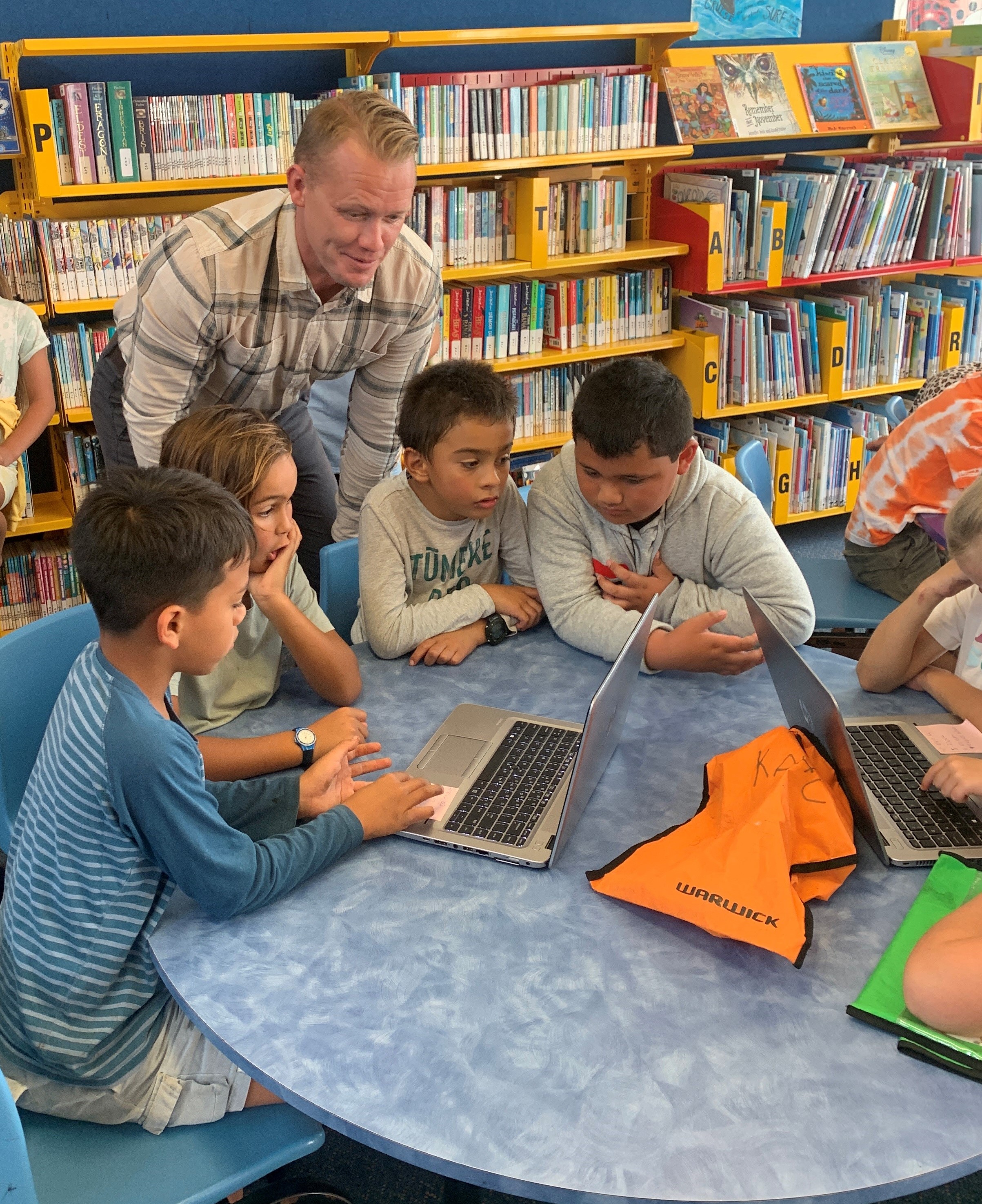Sam Wilburn with students from Waihi Beach School