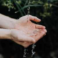 Water falling into a pair of hands