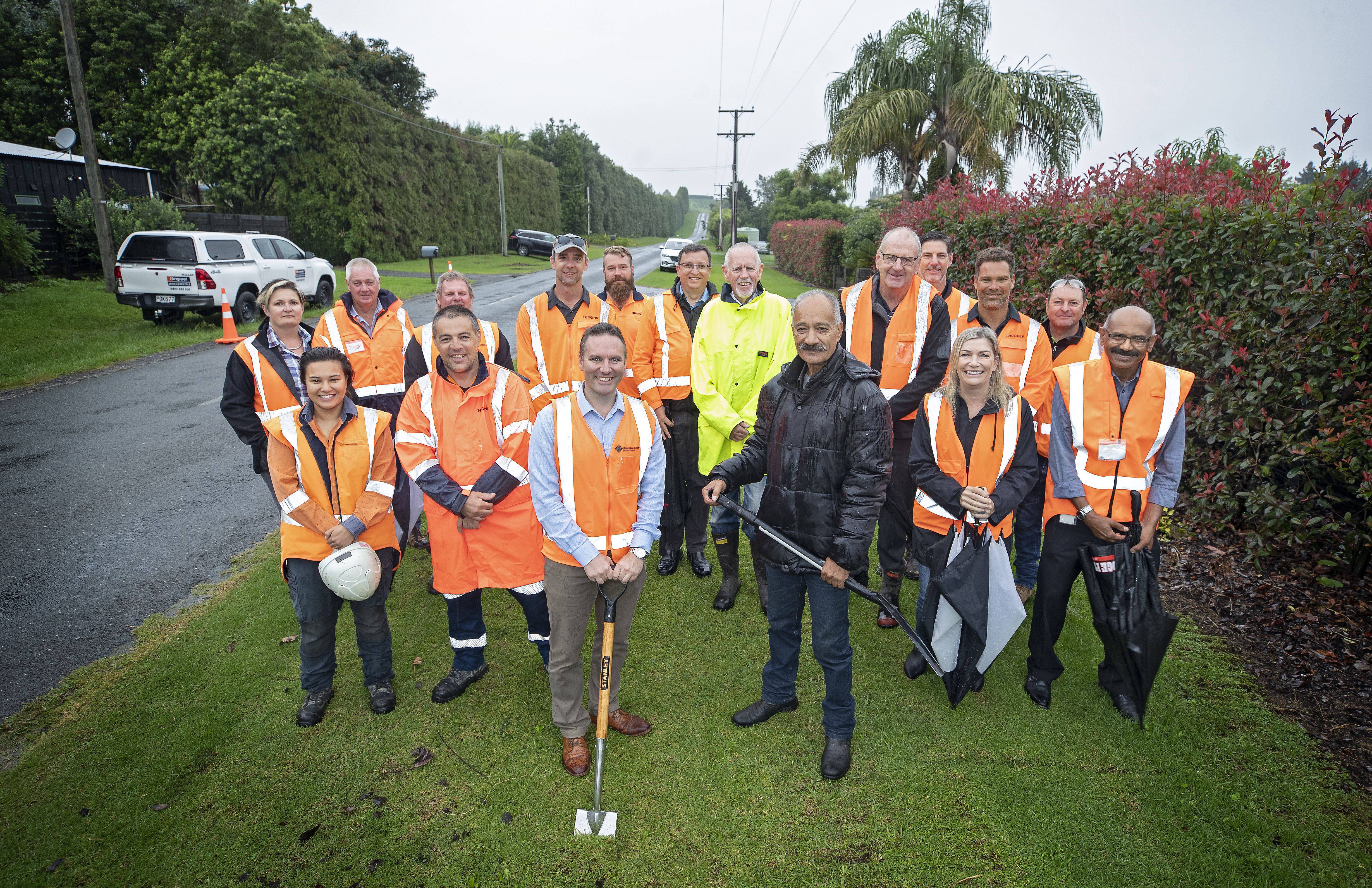 ​Western Bay Mayor James Denyer and Pirirakau hapū kaumatua Peter Borell turn the first sod on the Prole Road Urbanisation Project, along with the Higgins construction crew, Western Bay councillors and staff and project consultants.