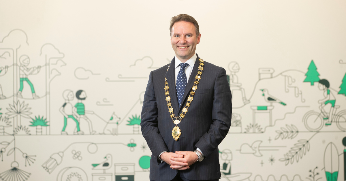 Western Bay of Plenty District Council Mayor James Denyer standing in Council chambers at the Barkes Cnr office