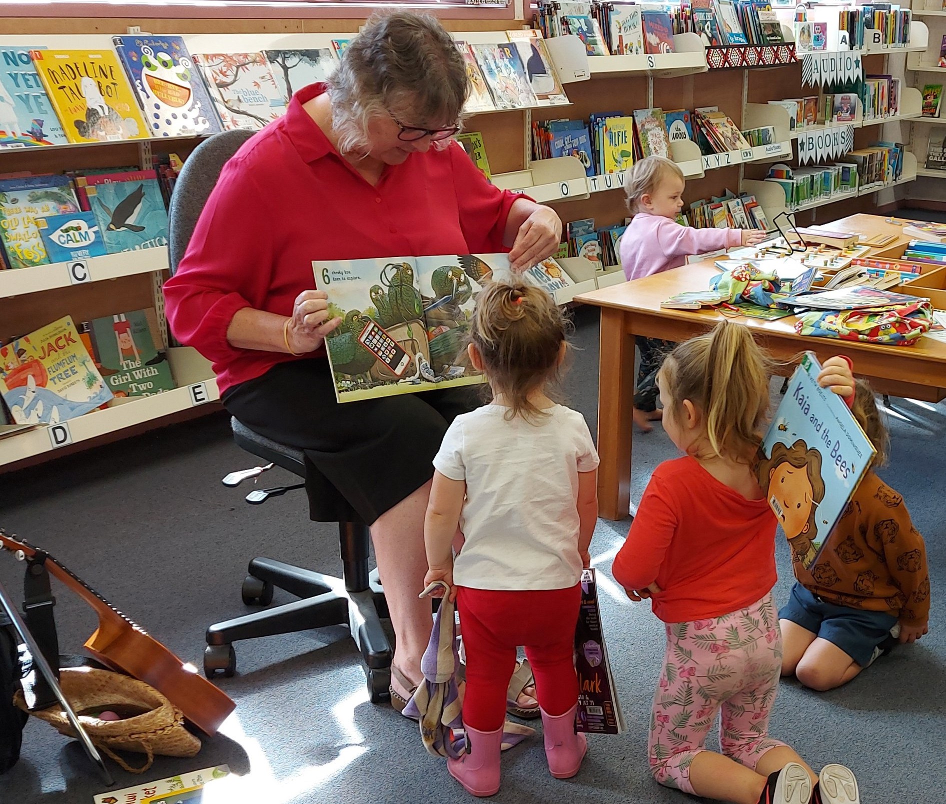 Little ones love story time in Waihī Beach Library with our Children and Teens Librarian Angela. 