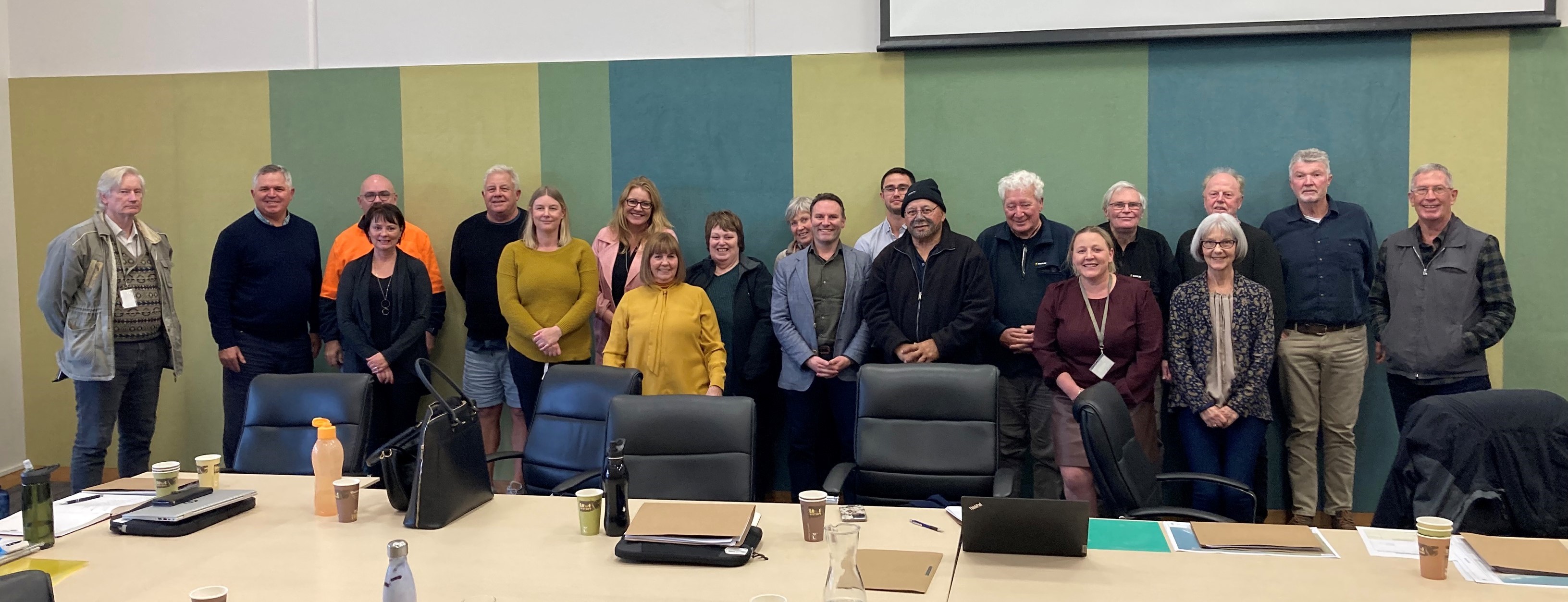 Attendees from the first Waihī Beach community liaison group meeting pose for a group photo. 